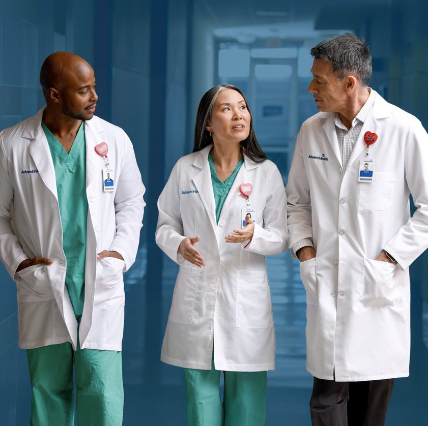 3 physicians walking and talking