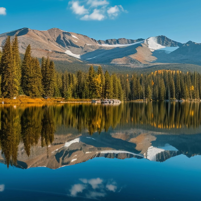 A pristine Colorado mountain lake surrounded by pine trees