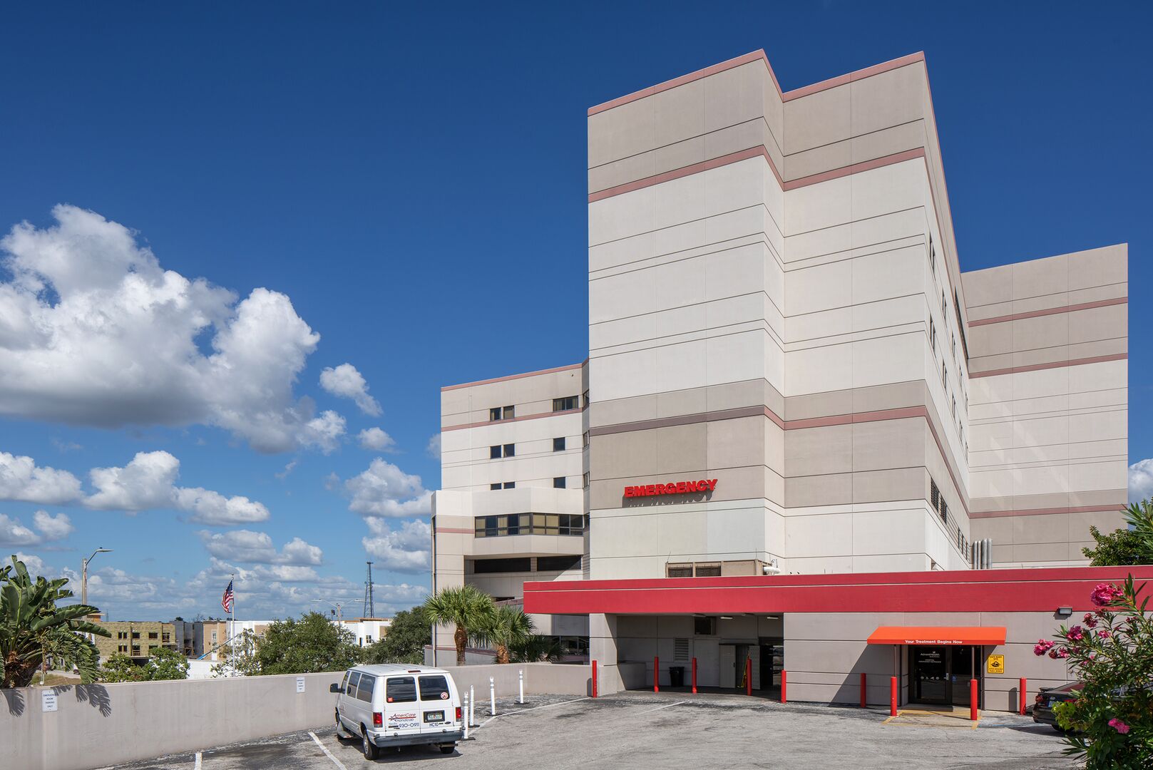 Exterior of AdventHealth North Pinellas hospital ER entrance during the day.