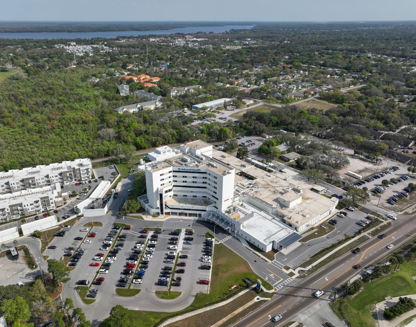 Daytime aerial view of AdventHealth North Pinellas hospital campus.