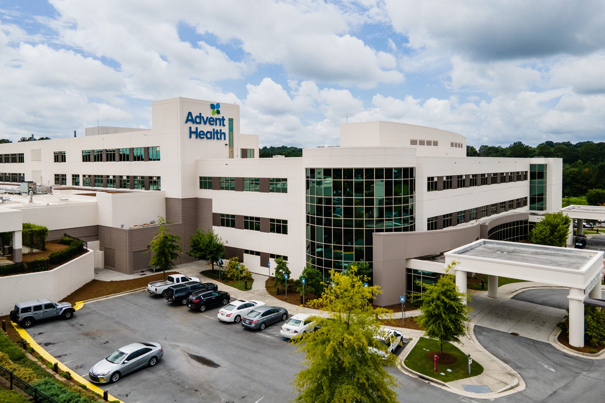 Exterior view of an AdventHealth Gordon medical campus with multiple buildings and parking areas.