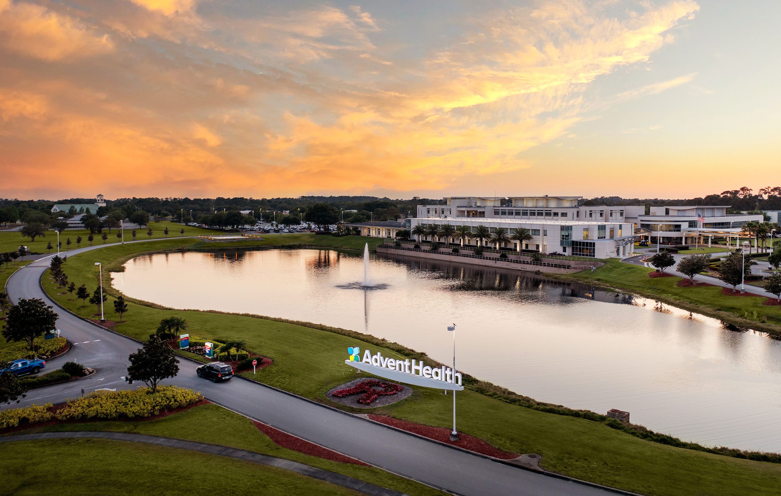 Exterior of AdventHealth Sebring hospital at dusk.