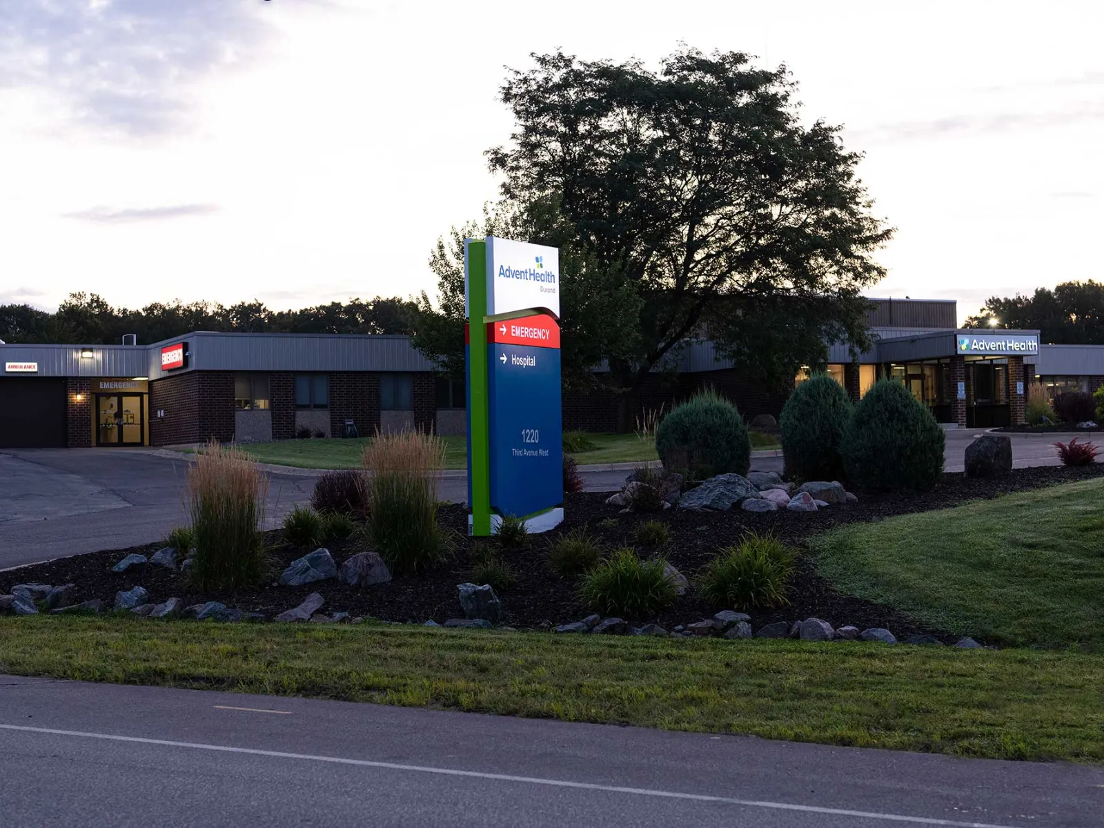 The AdventHealth Durand entrance sign shining at night.