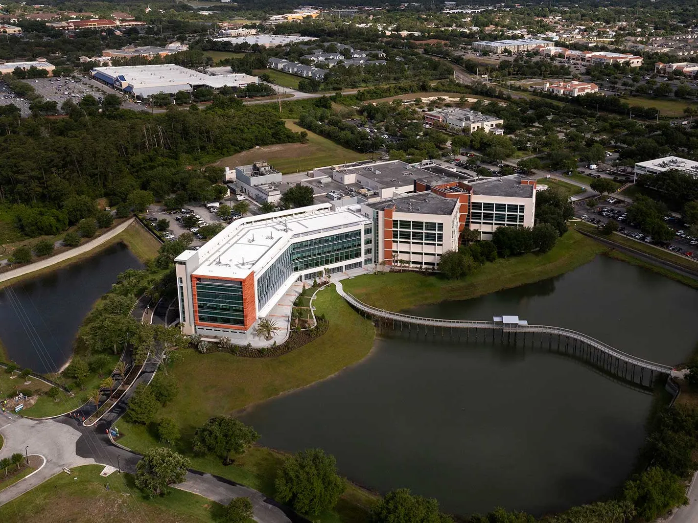 A bird's-eye view of the AdventHealth Fish Memorial building and surrounding area.
