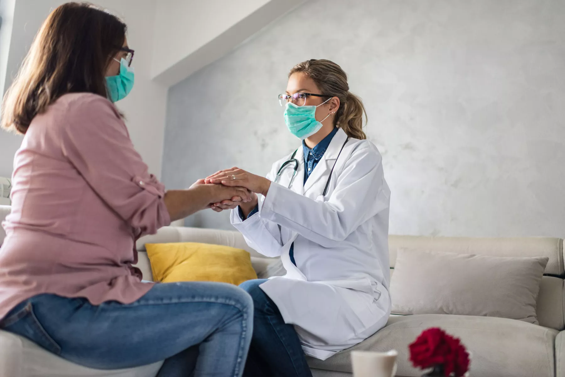 Doctor holding hand a woman's hand