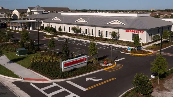 A view of AdventHealth Palm Parkway and its parking lot