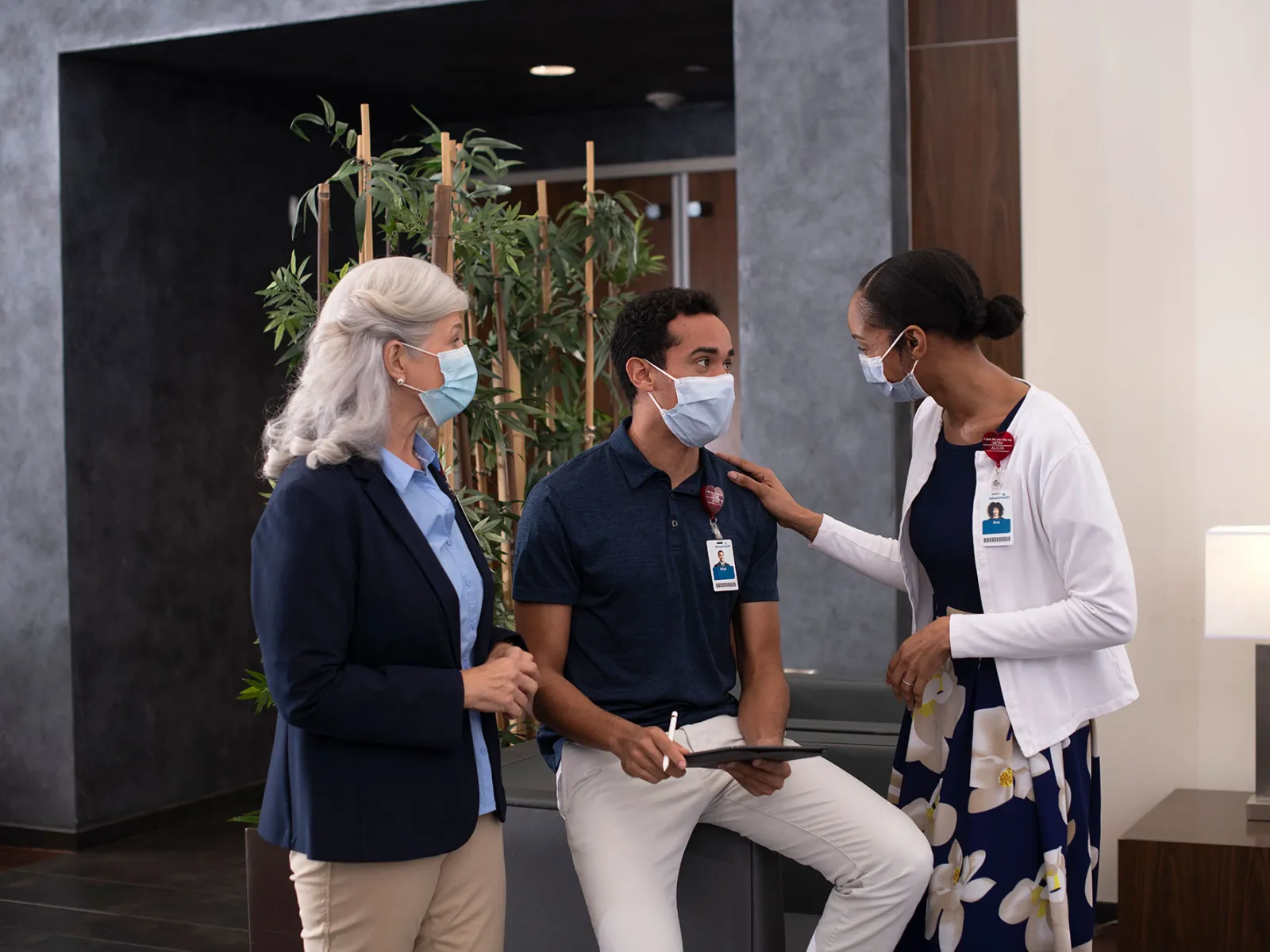 Three AdventHealth workers in a discussion