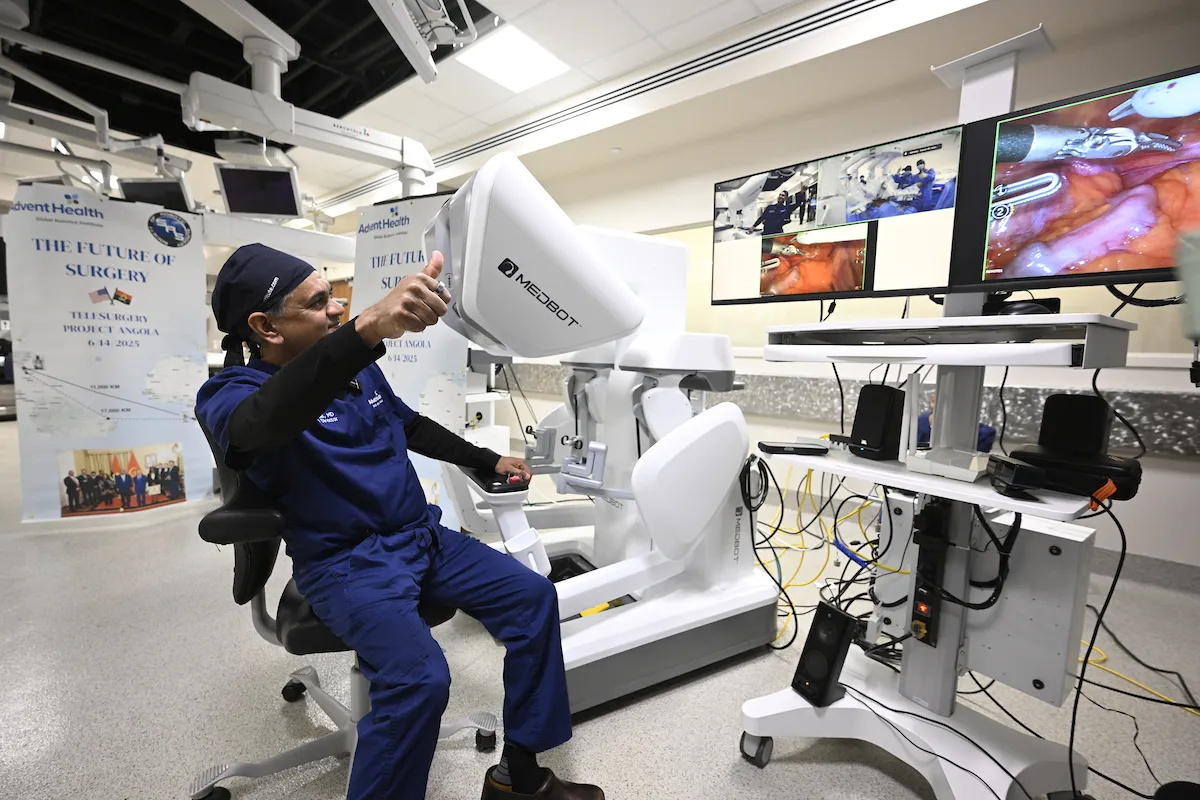 Dr. Vip Patel giving thumbs up to Angola telesurgery team