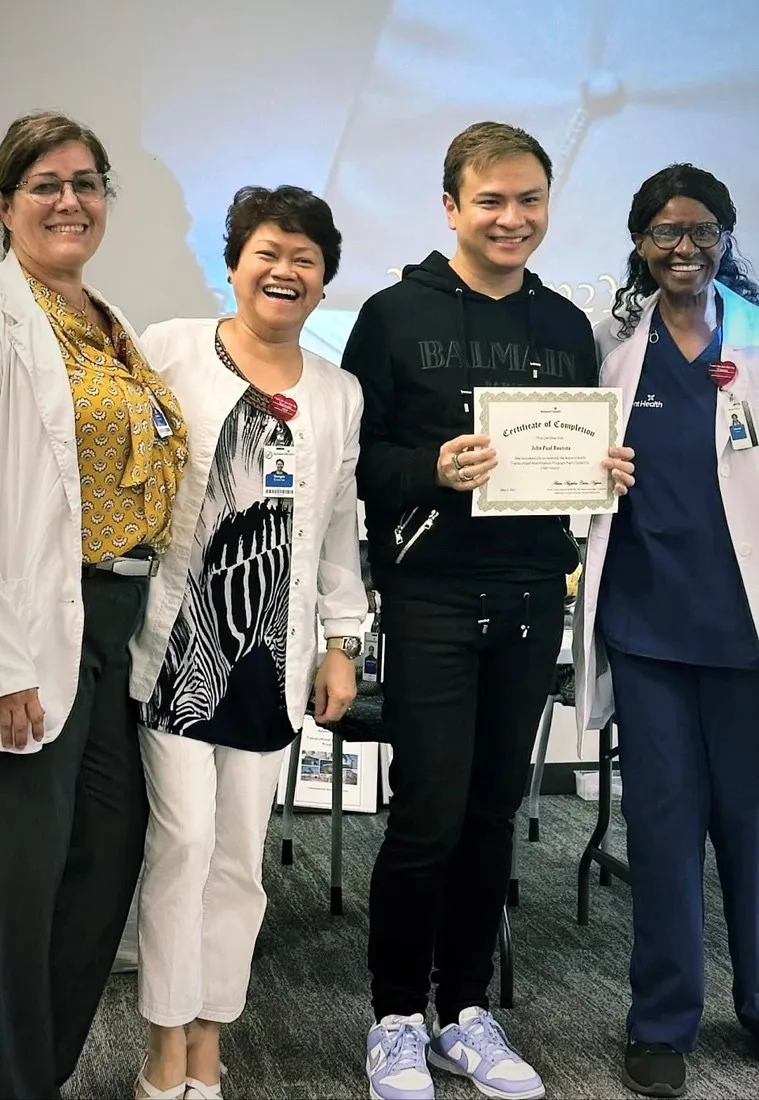 Yoena Usher (right) and teammates with a TAP graduate