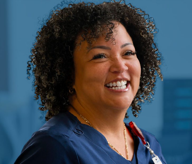 Female medical professional smiling at camera